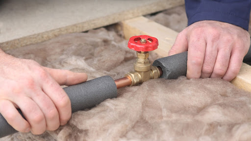 Plumber repairing a pipe fixture